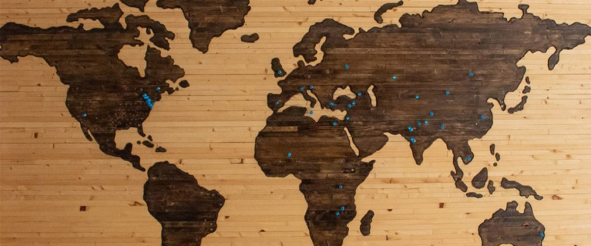 Brown wooden map board by Brett Zeck.
